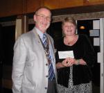 President John presents our Golf Day cheque to Chris Wynn from the Stroke Association